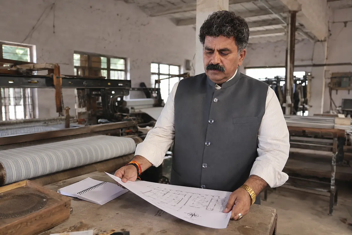 Vastu Vid Sunil Kumar Aaryan reviewing a factory layout in Panipat