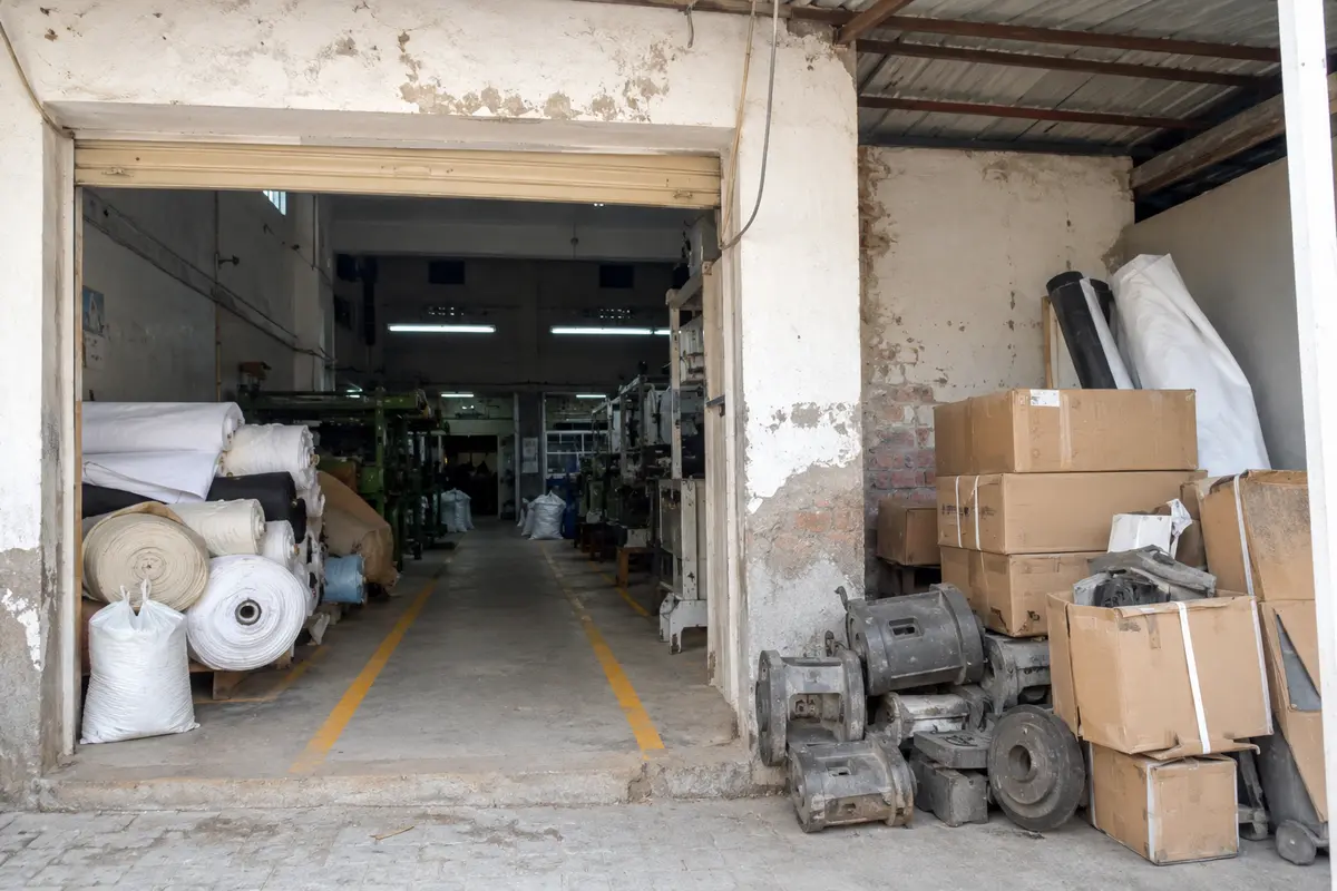 Obstructed factory entrance and material movement path